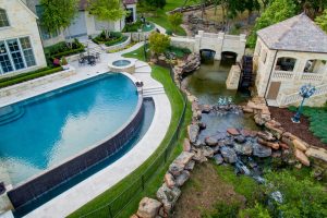 Flower Mound Infinity Pool with Water Wheel Claffey Pools