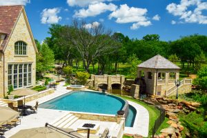 Flower Mound Infinity Pool with Water Wheel Claffey Pools