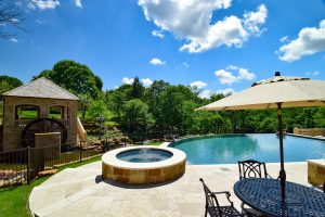 Flower Mound Infinity Pool with Water Wheel Claffey Pools