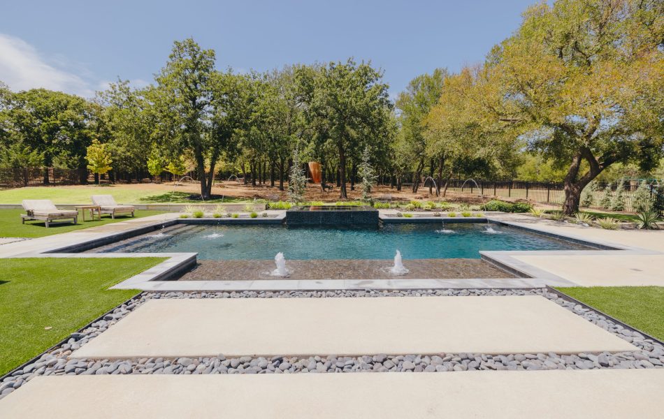 A swimming pool with fountains in